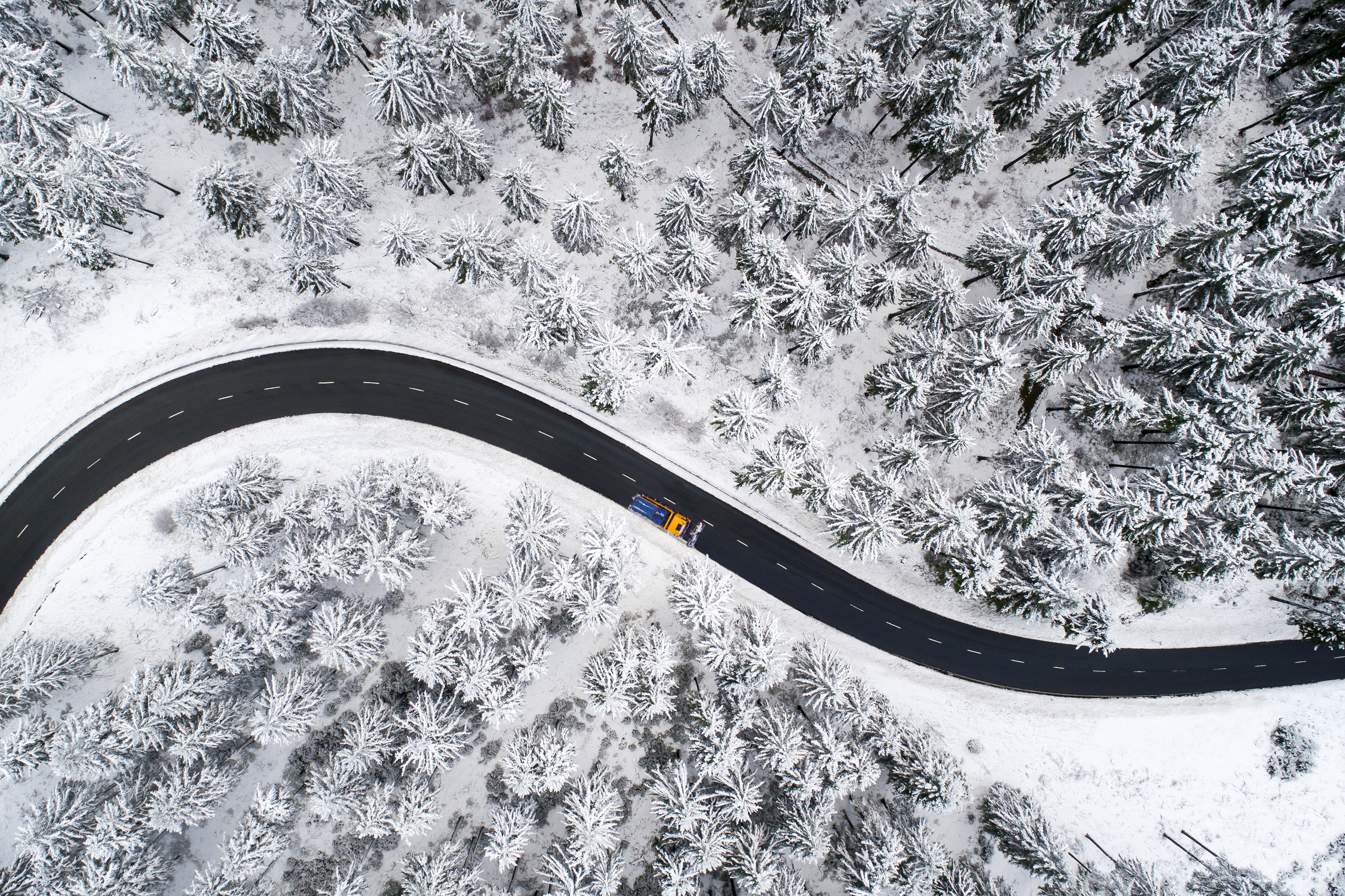 Eagle eye view of icy landscape with clear road (5:2)